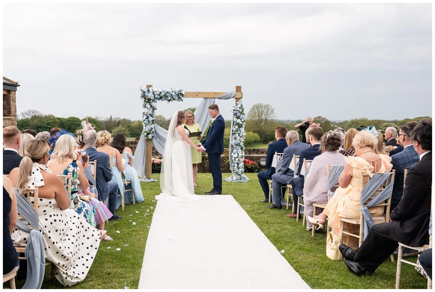 Outdoor Wedding ceremony at Beeston Manor Bride and groom saying their vows