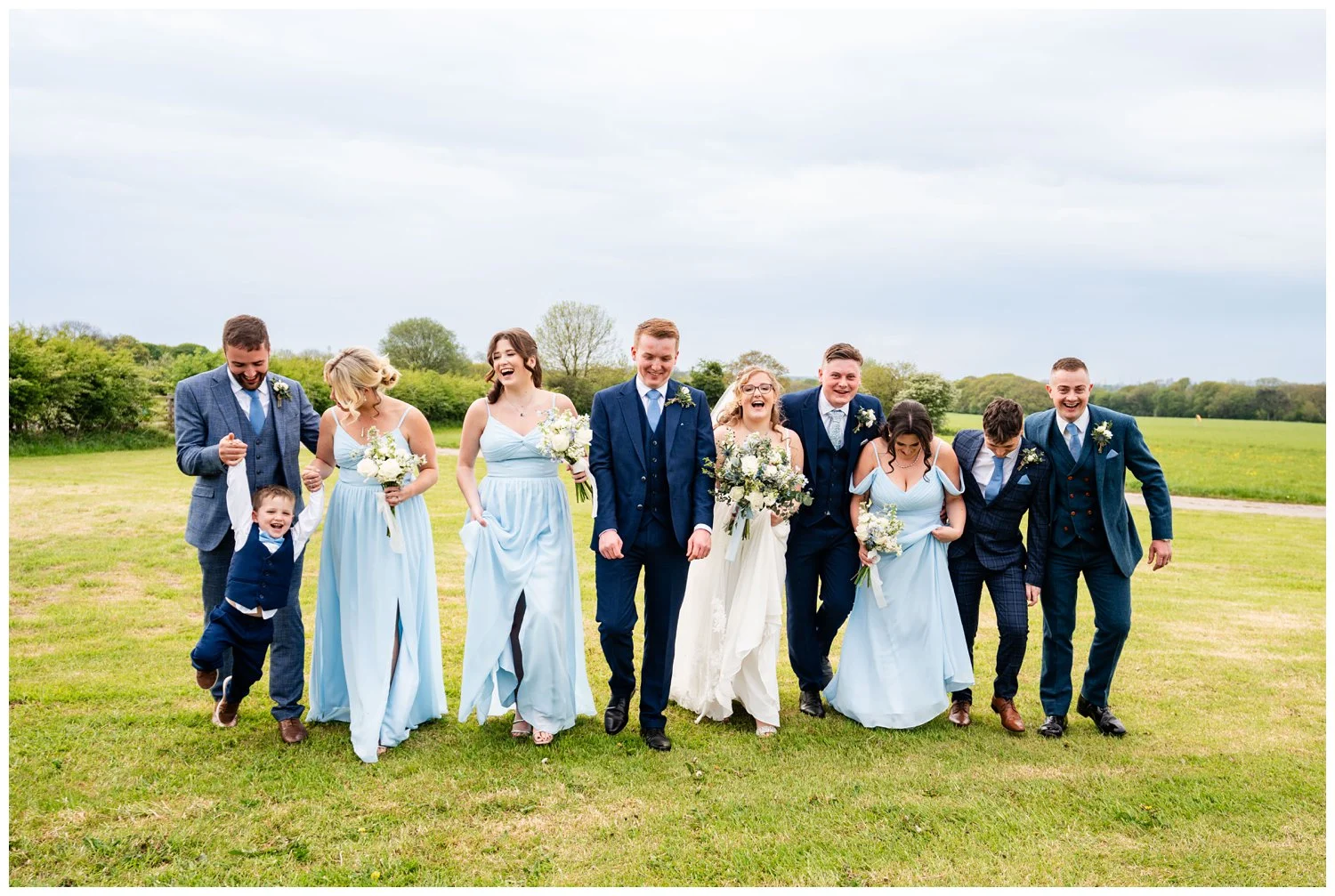 Wedding party laughing and walking together