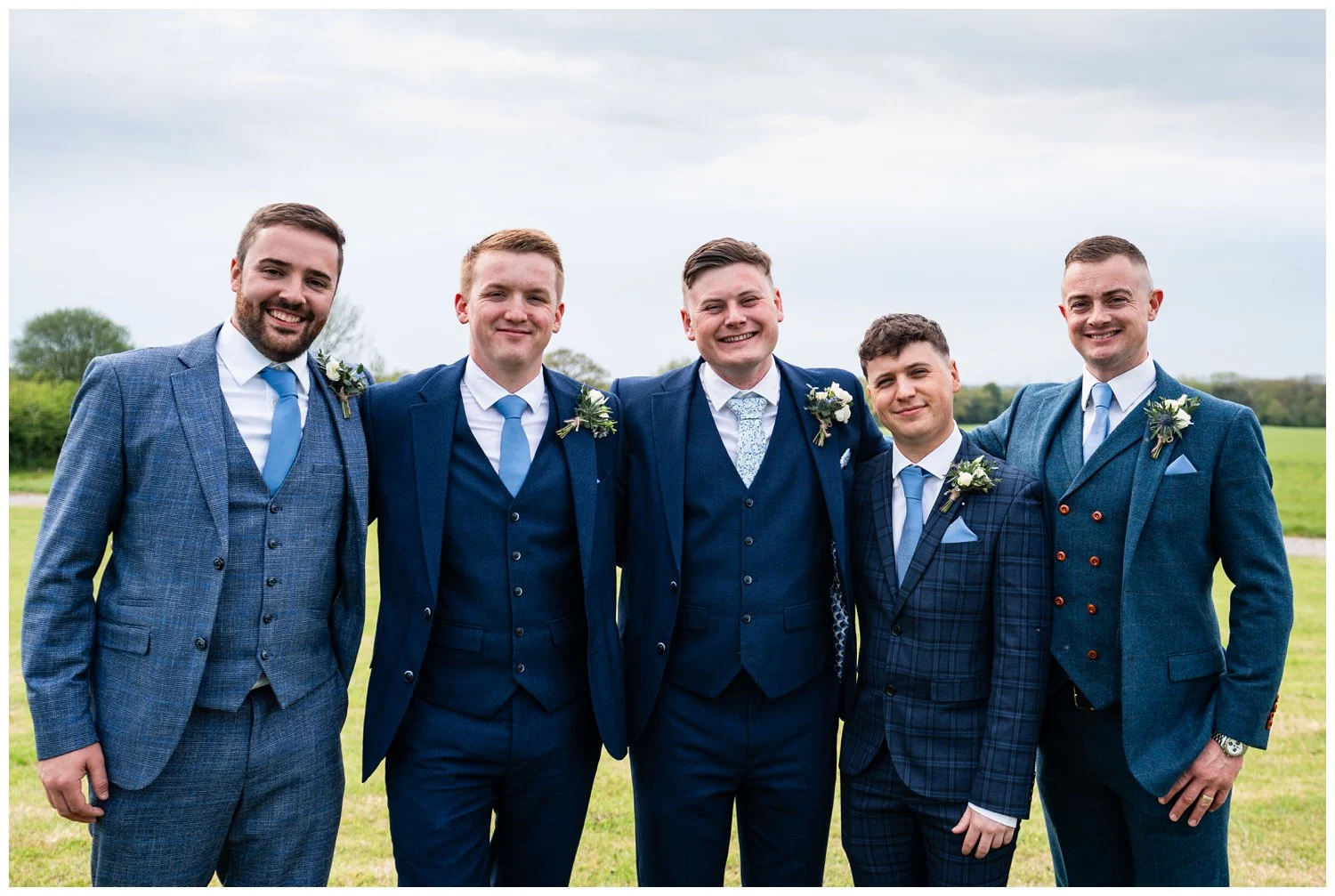 All the groomsmen royal blue suites and pale blue ties