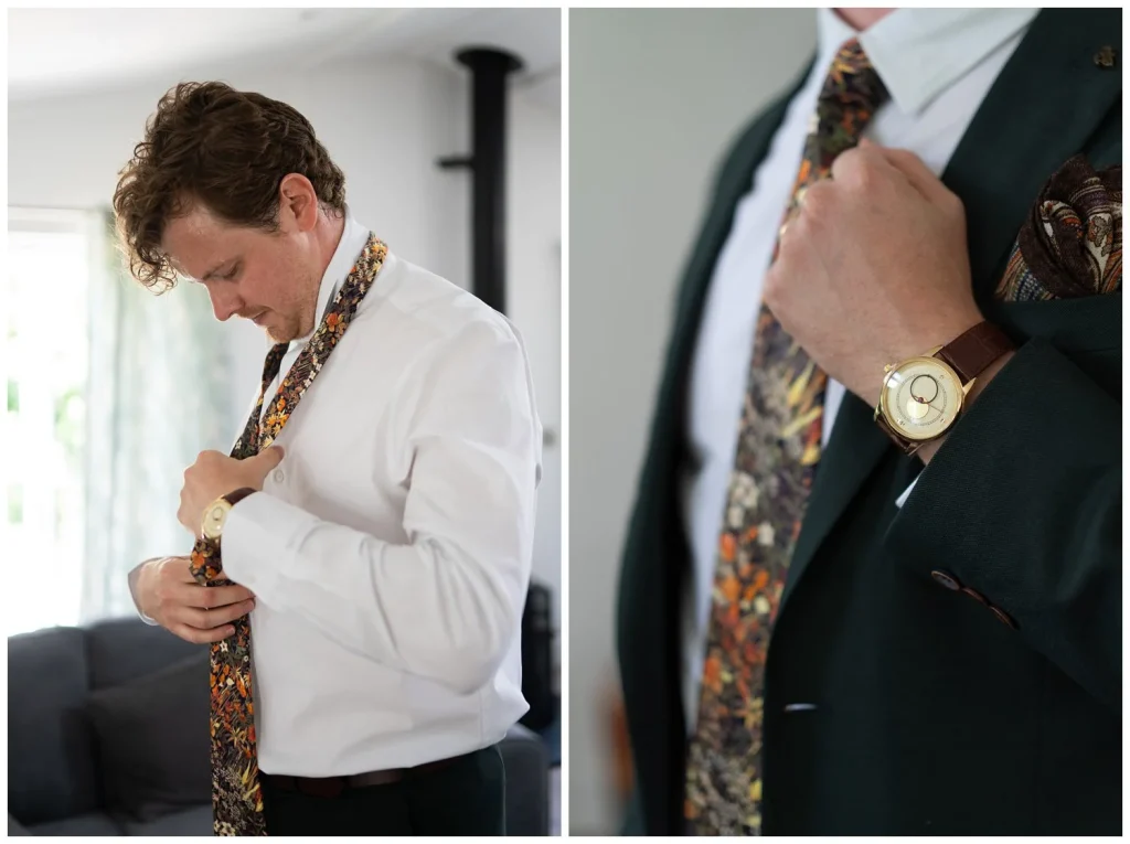 Groom fastening his tie